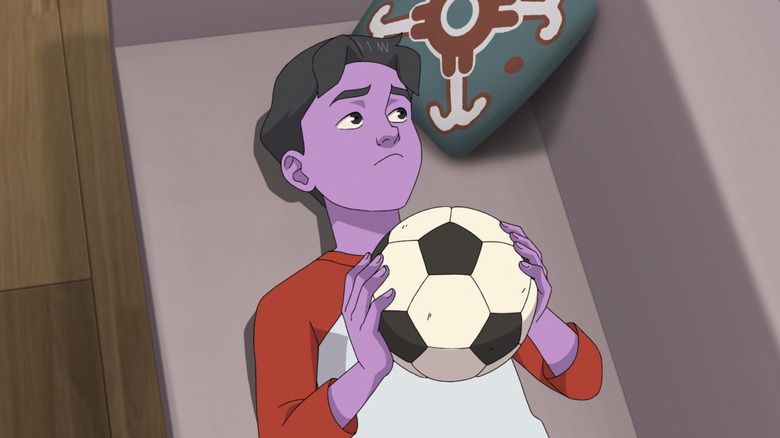 Christian Convery's Oliver Grayson holding a soccer ball on Invincible