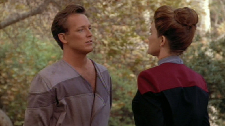 Tom Paris in a prison uniform talking to Captain Janeway on Star Trek: Voyager