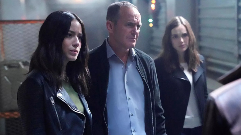 Chloe Bennet, Phil Coulson, and Jemma Simmons look concerned in Agents of SHIELD