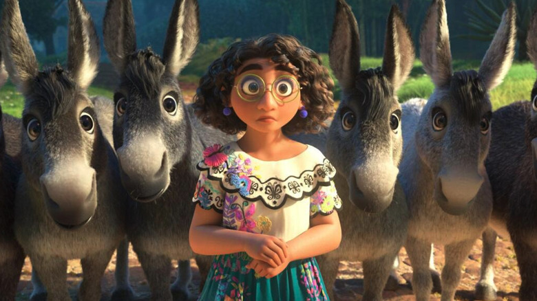 Mirabel surrounded by donkeys looking surprised in Encanto