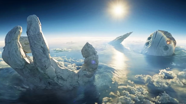 A dead Celestial peeking up out of the ocean in Eternals