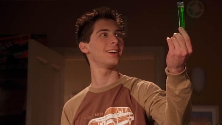 Justin Berfield as Reese holding a vial of fluid on Malcolm in the Middle