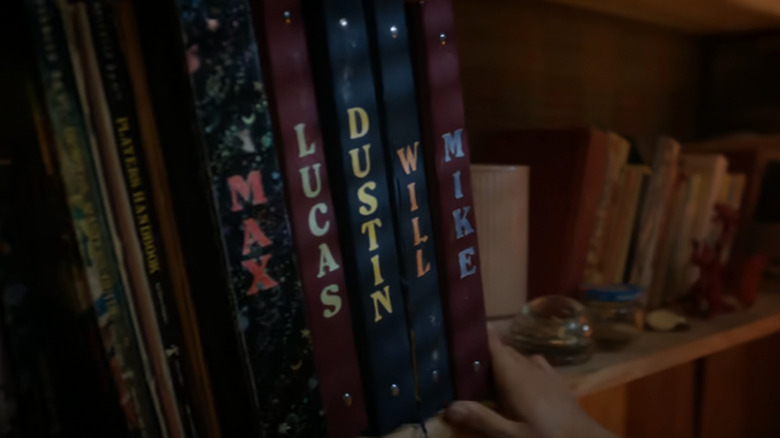 The Dungeons and Dragons books of the Party are seen sitting on a shelf in Stranger Things