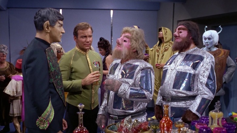 A room full of alien delegates, along with Sarek and Kirk on Star Trek