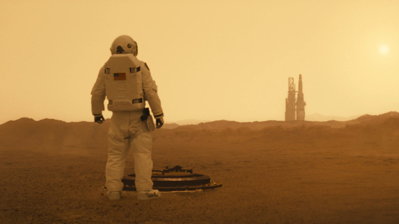 Roy McBride stands on Mars