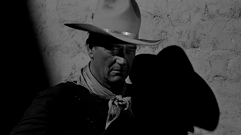 John Wayne as Tom Doniphon wearing a cowboy hat in The Man Who Shot Liberty Valance