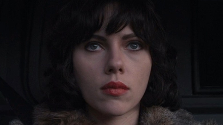 Scarlett Johansson sitting in car in Under the Skin