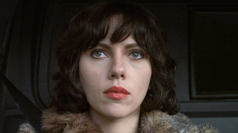 Scarlett Johansson sitting in car in Under the Skin