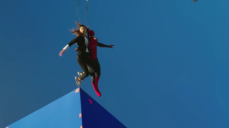 Zendaya and Spider-Man suspended on wires