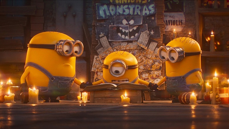 The Minions reading from a book of spells in Minions & Monsters