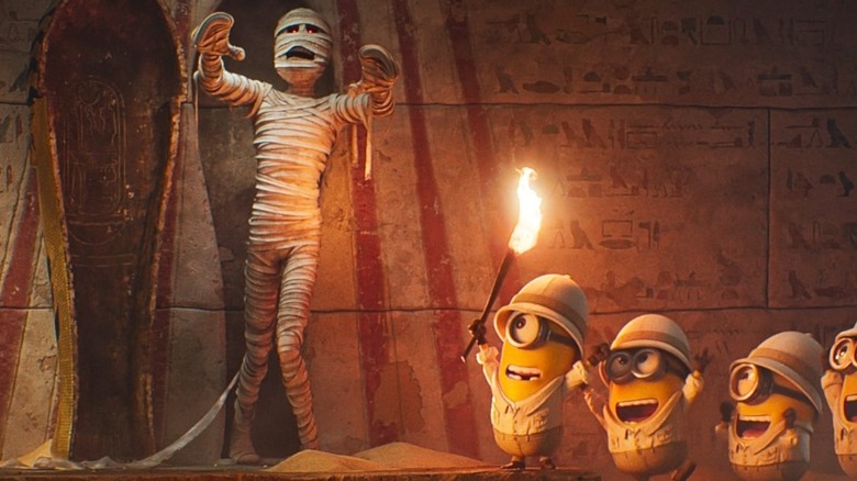 The Minions looking at a mummy in Minions & Monsters