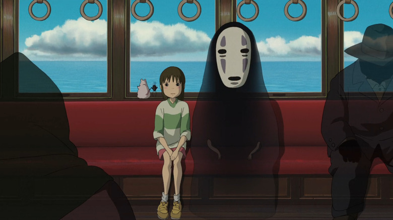 The transformation is far away, Chihiro and the face and the face sit in a train, surrounded by lives.