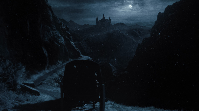A carriage travels to Orlok's castle in Nosferatu (2024)