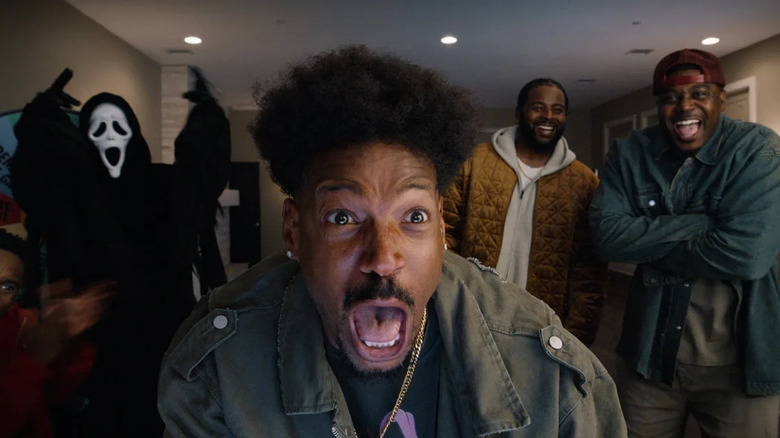 Marlon Wayans as Shorty yelling with Ghostface and some of his friends in the background in Scary Movie (2026)