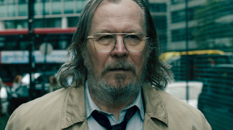 Gary Oldman's Jackson Lamb walks down a London street in Slow Horses