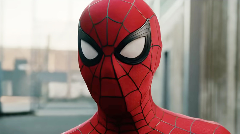 Tom Holland as Spider-Man standing on a street in Spider-Man: Brand New Day