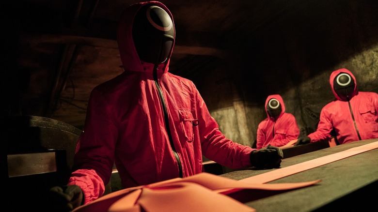 Squid Game Season 1 workers in building