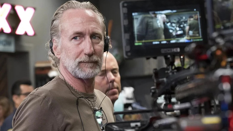 Brian Henson, wearing headphones, looking at a camera behind the scenes of The Happytime Murders.
