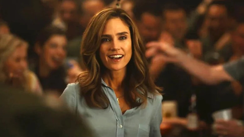 Penny smiling through a crowd in Top Gun: Maverick