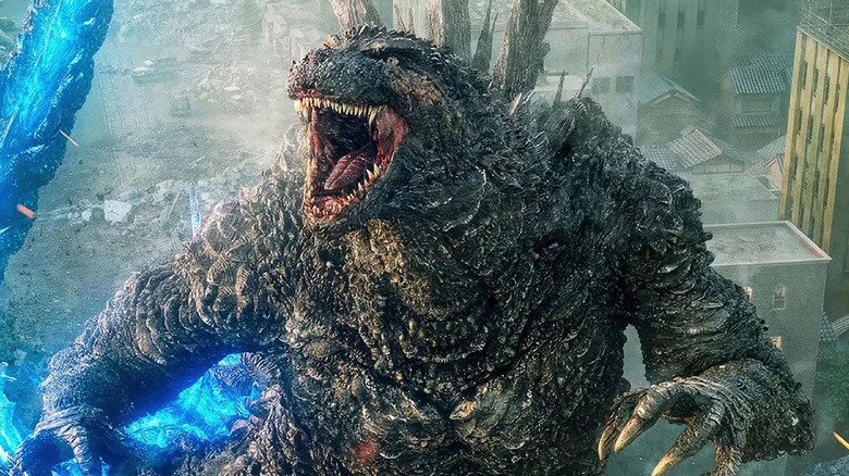 Godzilla coming out of the water to attack Tokyo