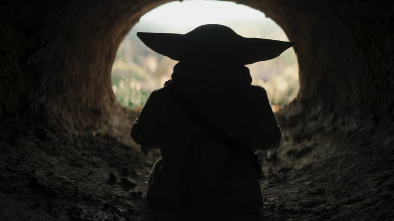 Grogu walking out of his mud hut in The Mandalorian and Grogu