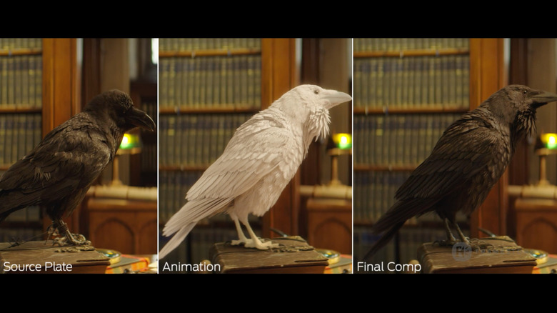 three sculptures of ravens