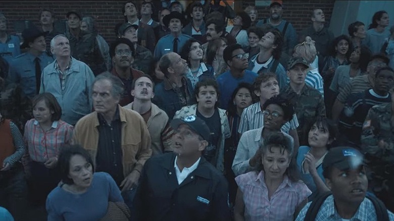 The Hawkins citizens looking at the sky in Stranger Things 4