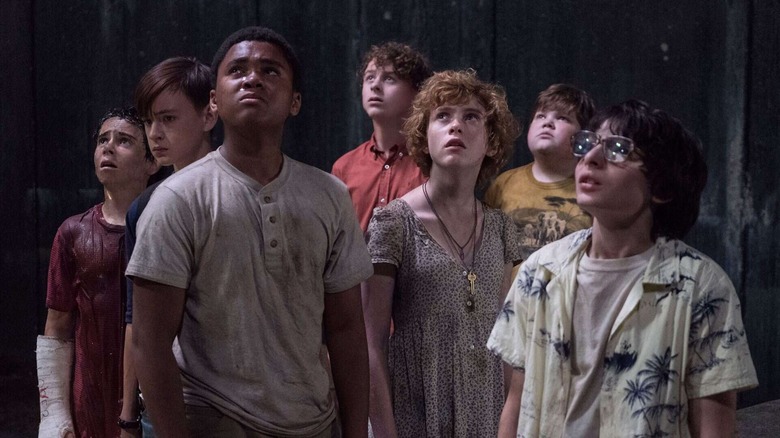 The seven members of the Losers Club look up in fear