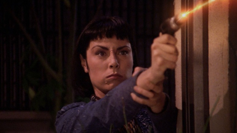 Ensign Ro firing a phaser, fighting with the Maquis, on Star Trek: The Next Generation