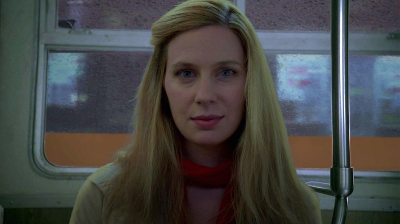 Anne Dudek as Dr. Amber Volakis sitting on a bus on House M.D.