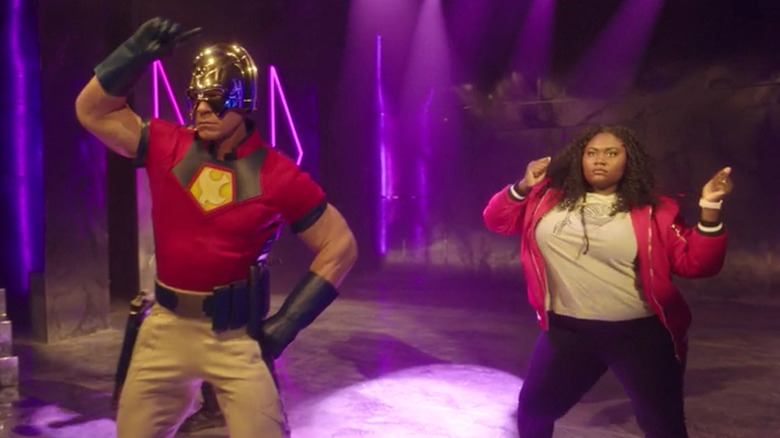 John Cena as Peacemaker and Danielle Brooks as Leota Adebayo dancing on Peacemaker