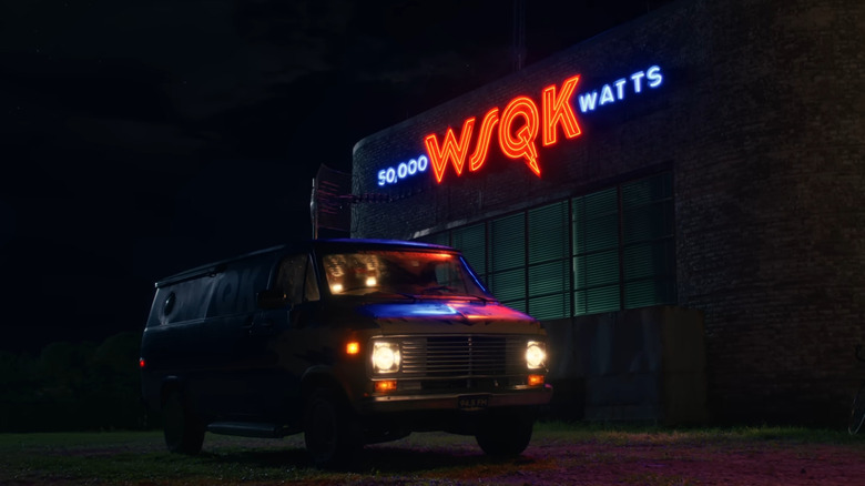 A van parked in front of a radio station at night in Stranger Things season 5