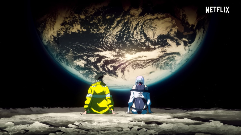 cyberpunk edgerunners man and woman sit staring at Earth