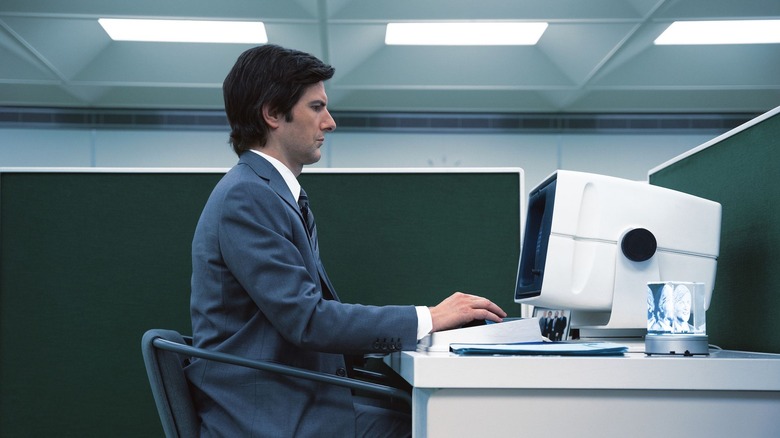 Mark S. Sitting on his computer on separation