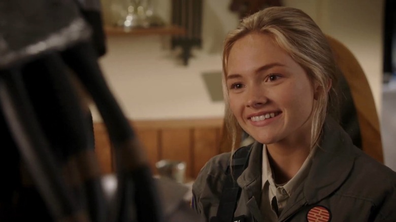 Natalie Alyn Lind as Dana Caldwell smiling in The Goldbergs