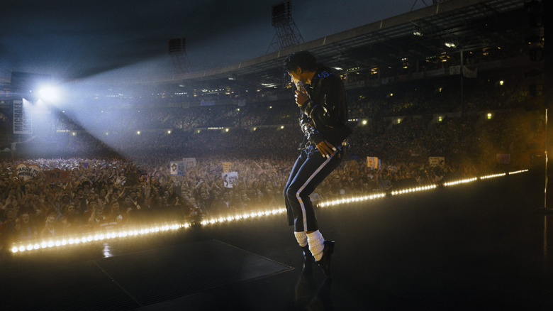 Michael Jackson dancing on the stage in his Bad costume in Michael