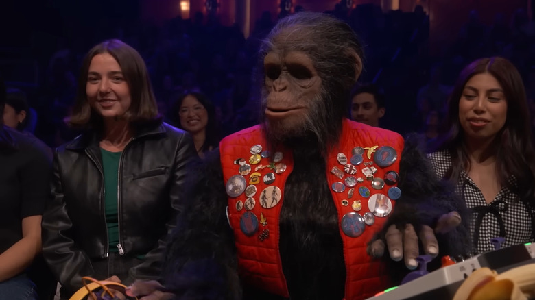 Bubbles in a jacket directing a show on Everybody's Live with John Mullaney