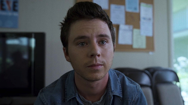 Charlie McDermott as Ty in a school room in Unbelievable