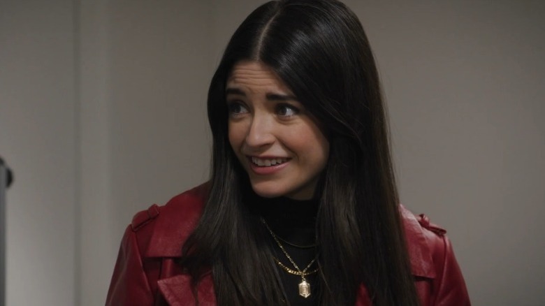 Daniela Bobadilla as Dillon Michaels smiling nervously in The Happy Camper