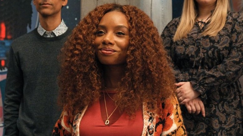 Imani Hakim as Dana Bryant, smiling smugly on Mythic Quest