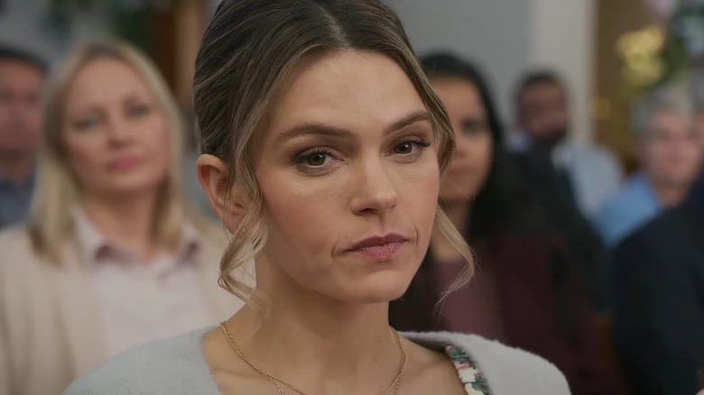 Aimeé Teegarden as Amanda, frowning at church in An Easter Bloom