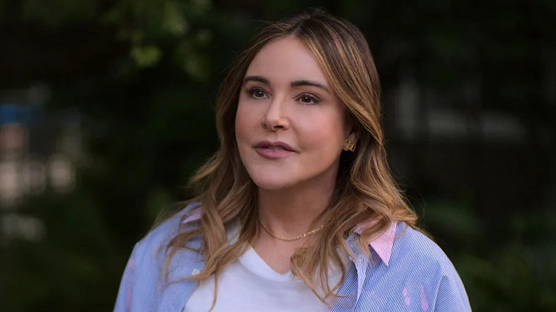 Christa Miller as Liz, smiling in her yard on Shrinking