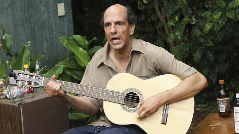 Sam Lloyd playing guitar as Ted in Cougar Town