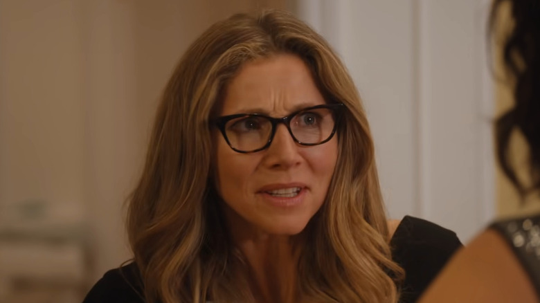 Sarah Chalke as Kate Mularkey, looking through glasses on Firefly Lane