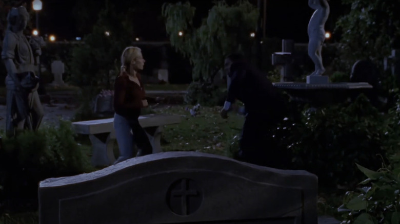 Sarah Michelle Gellar's Buffy fights a vampire in Sunnydale Cemetery in Buffy the Vampire Slayer
