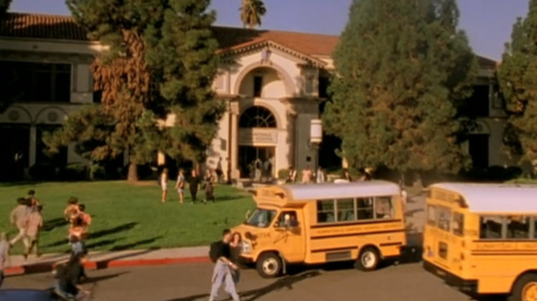 Sunnydale High School is seen with school buses in front in Buffy the Vampire Slayer