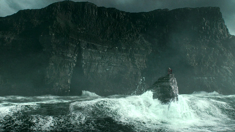 Harry and Dumbledore standing outside of the cave in Harry Potter and the Half-Blood Prince