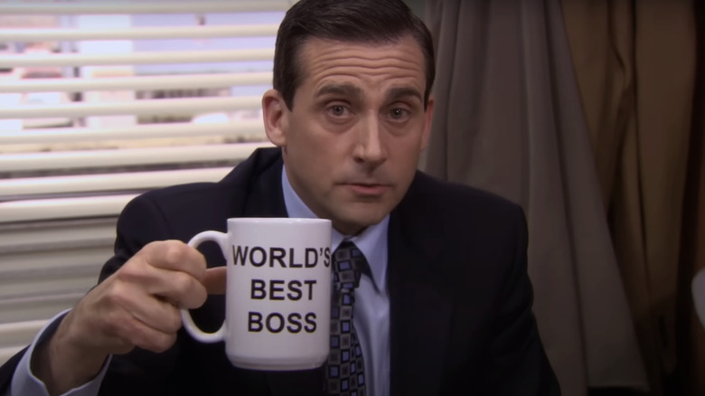Steve Carrell's Michael Scott holds up his World's Best Boss mug in The Office