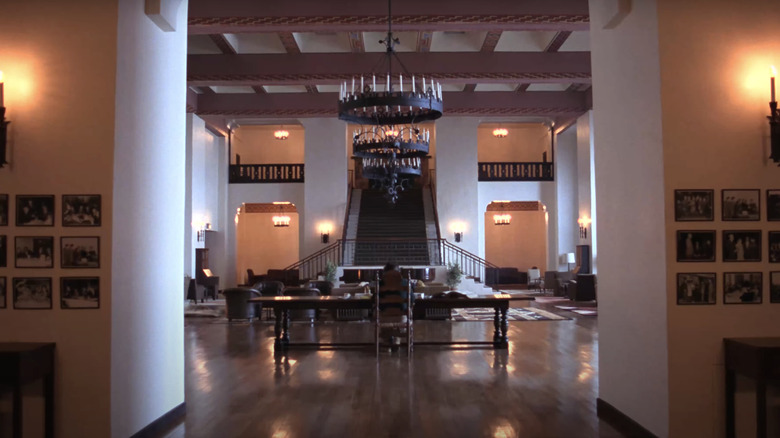 Jack Nicholson's Jack Torrance is seen from behind sitting in the hall of the Overlook hotel is seen in The Shining