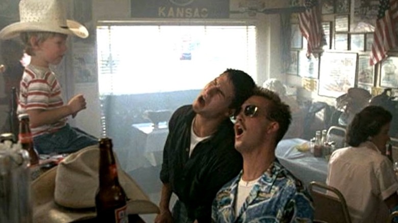 Tom Cruise as Pete "Maverick" Mitchell and Anthony Edwards as Nick "Goose" Bradshaw belt out Great Balls of Fire in Top Gun